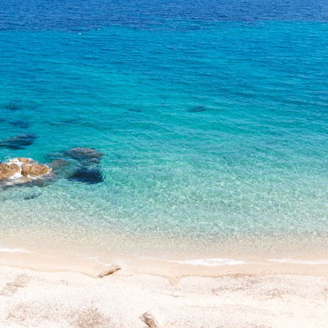 Spend the day at the beautifully pristine Psarou Beach, just a thirty-minute stroll from home 