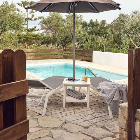 Laze around the private pool on the secluded patio
