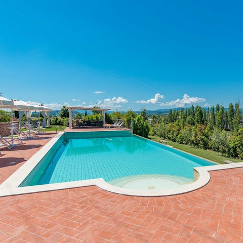 Spend days gazing at the Tuscan countryside from the poolside