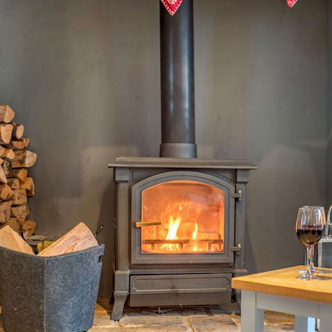 Get a fire going in the wood-burning stove to keep things cosy