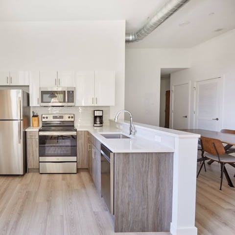 Fire up the coffee machine in the sleek, modern kitchen