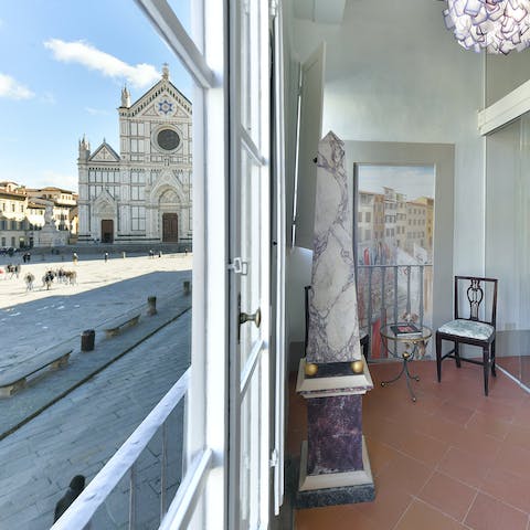 Feast on views of Piazza di Santa Croce and its beautiful basilica from the living room