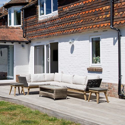 Relax around the outdoor sofa set while the kids play on the trampoline or table tennis