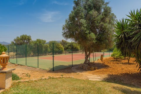 Play a game of tennis with loved ones on the private court