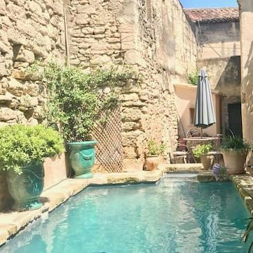 Go for a dip in the shared pool surrounded by stone walls and pretty plants