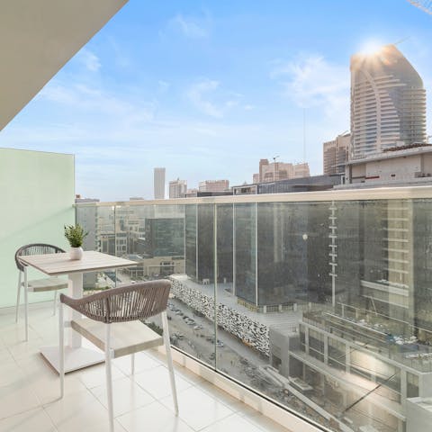 Enjoy a cool drink on your private balcony as you take in the views over the Business Bay area