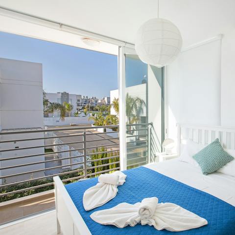 Floor to ceiling glass doors open out onto private balconies in every bedroom