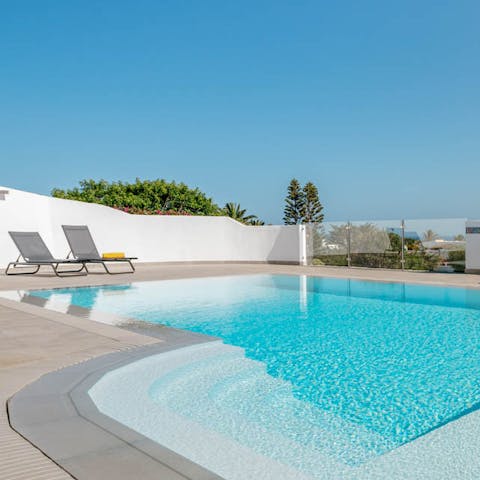 Dip your toes in the cool waters of the private outdoor swimming pool, or relax on a poolside lounger