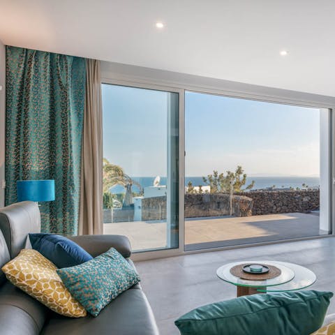 Admire the ocean views from inside through the floor-to-ceiling windows