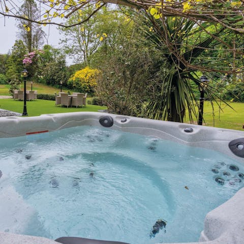 Slip into the hot tub and relax after a day of exploring