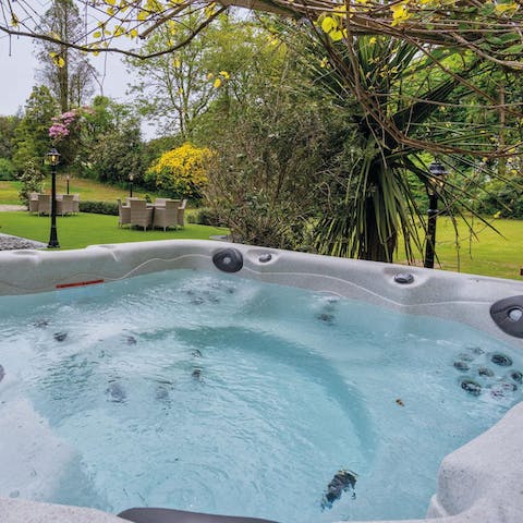 Slip into the hot tub and relax after a day of exploring