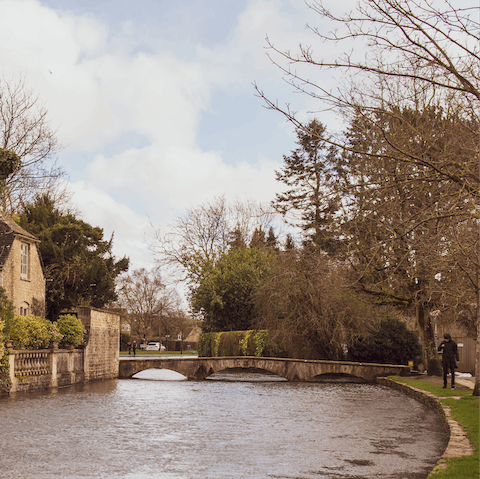Visit Bourton-on-the-Water and enjoy a meal beside the River Windrush
