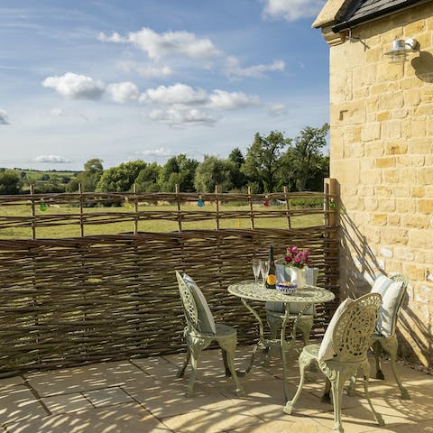 Enjoy alfresco drinks as you soak up the rolling countryside views