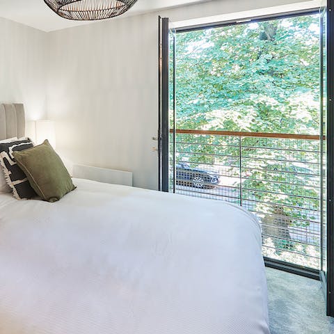 Wake up to a view of the lovely leafy street below and let in a wave of fresh air