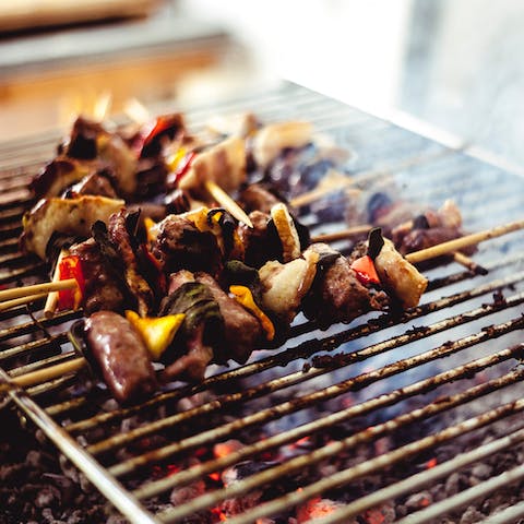 Fire up the barbecue on the gorgeous terrace overlooking the pool, sea, and mountain landscapes