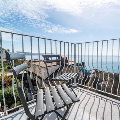 Watch the waves roll in on the private balcony