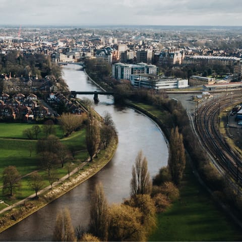 Enjoy a gentle river walk into the city centre