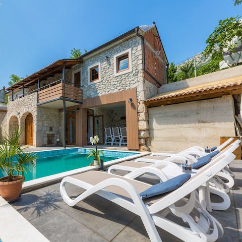 Soak up the sun on the poolside loungers in between cooling dips in the heated pool