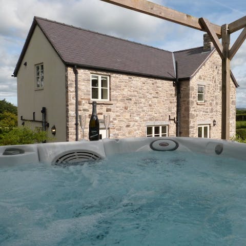 Relax with a glass of bubbly in the hot tub
