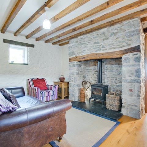Fire up the wood-burning stove and make it a cosy evening in under the beamed ceiling