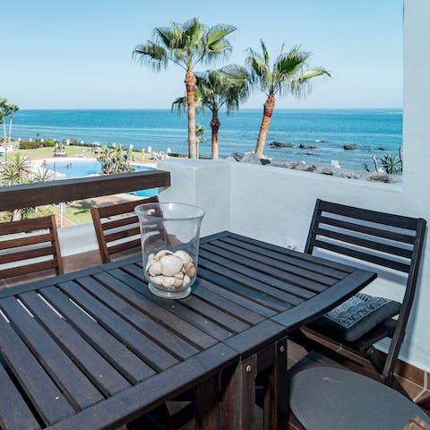 Admire the sea views with coffees on the private balcony