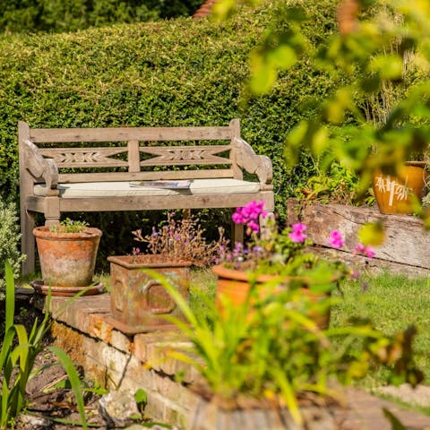 Unwind in the south-facing garden before firing up the barbecue