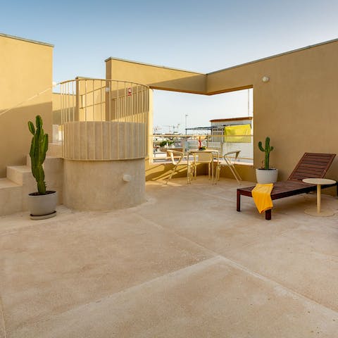 Head up to the shared rooftop terrace for a sunbathing session