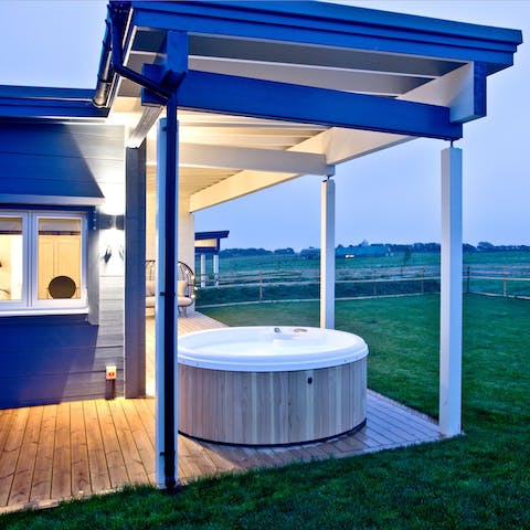 Jump in the hot tub and soak the night away under the stars