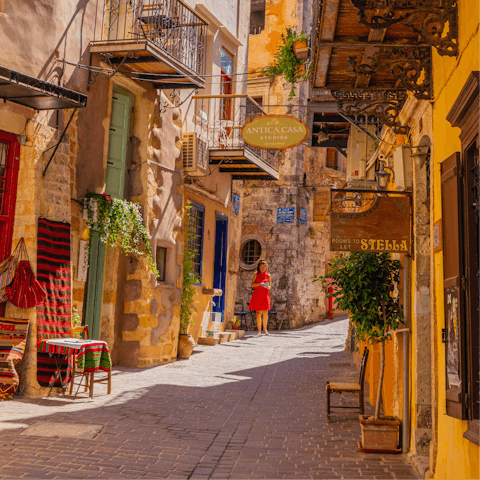 Weave through the charming streets of Chania, a fifteen-minute drive from your villa