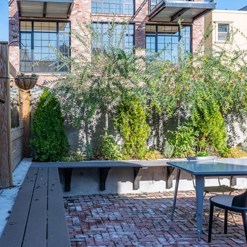 Spend sunny days in the private backyard, furnished with tables and chairs