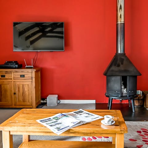 Cosy up around the wood burner – you're welcome to use logs from the owner's wood store