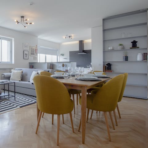 Dine in style, upon the parquet flooring of the living space