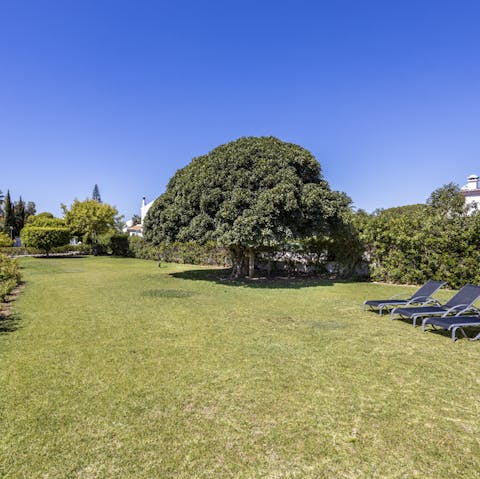 Find a peaceful spot to soak up some rays in the home's large garden