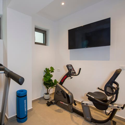 Keep fit in the well-equipped home gym downstairs