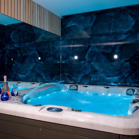 Unwind in the bubbles of the Jacuzzi in the home spa