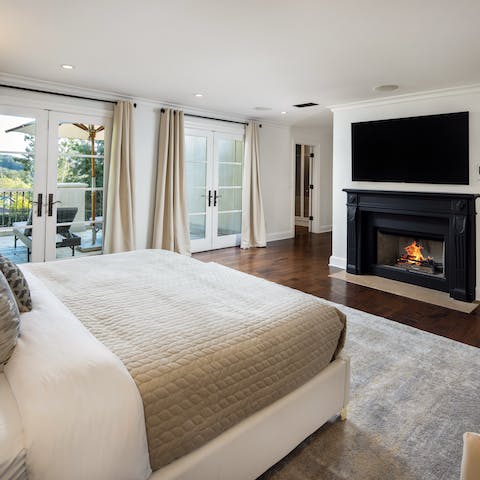 Feel at home in the huge master bedroom and ensuite – complete with balcony and fireplace