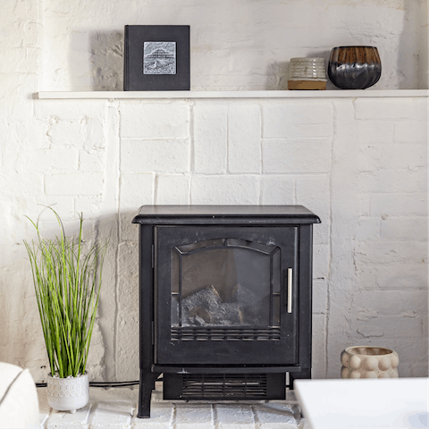 Gather around the home's original inglenook fireplace for a cosy evening