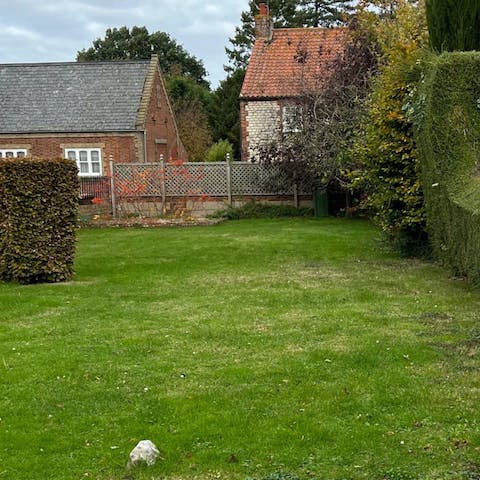 Gather together for some lawn games in the front garden