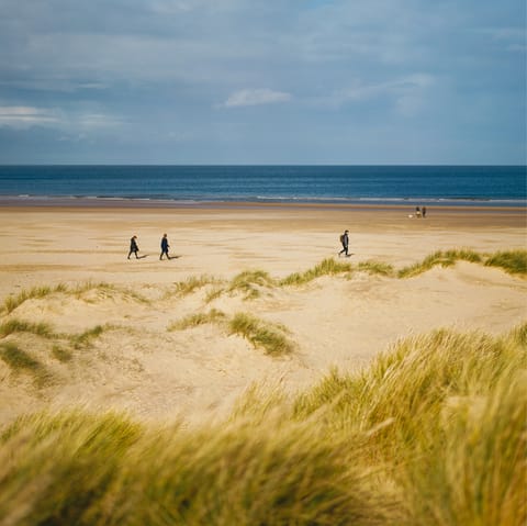 Spend sunny afternoons at Brancaster Beach, under a ten-minute drive away