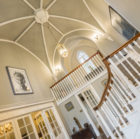 Admire the view from this original wooden staircase in the entrance hall