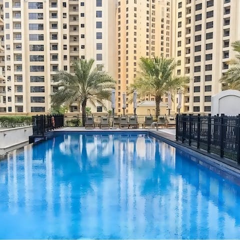 Swim in the communal pool to beat the Dubai heat