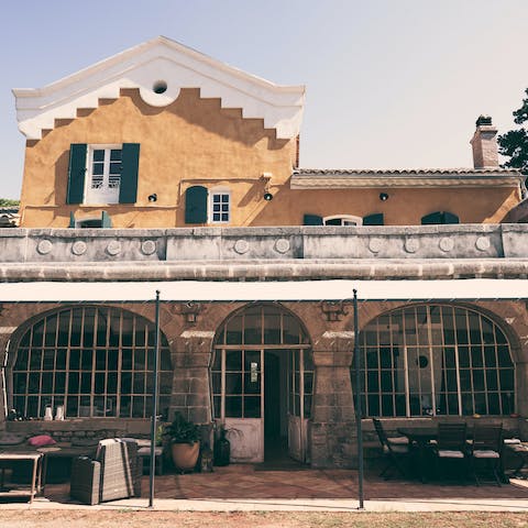 Escape the Provençal sunshine and dine alfresco on the roofed patio