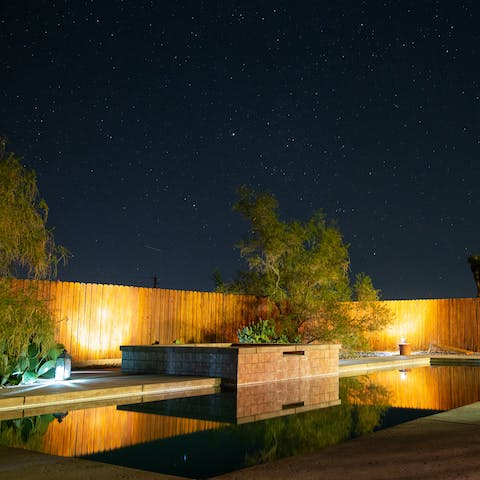 Sit out under the stars with a glass of bubbly in the jacuzzi