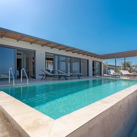 Take a dip in the private infinity pool for some respite from the Greek heat