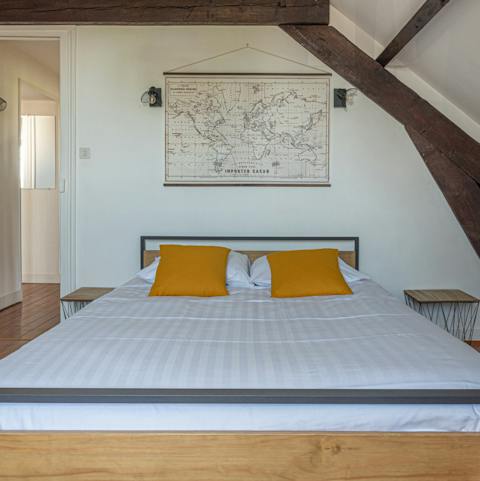 Get a good night's rest in the charming bedroom under the wood beams