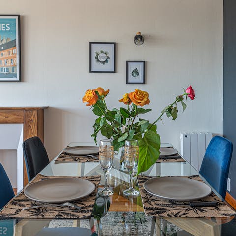 Enjoy delicious communal meals at the dining table 