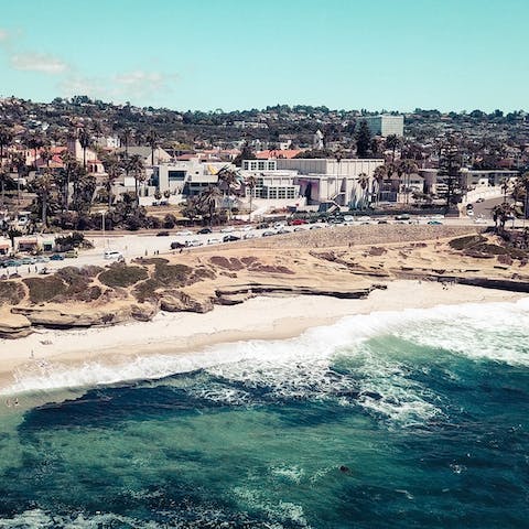 Hit the waves at Windansea Beach, a seven-minute walk away