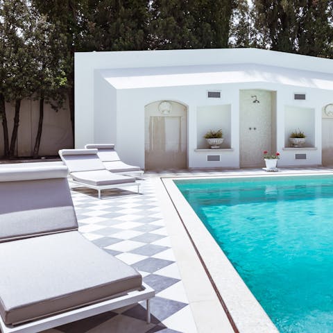 Spend lavishly lazy days relaxing by the pool