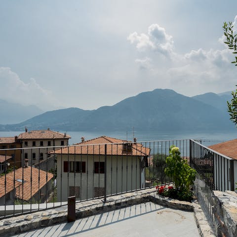 Drink in beautiful views of the mountains surrounding Lake Como from the home's two terraces