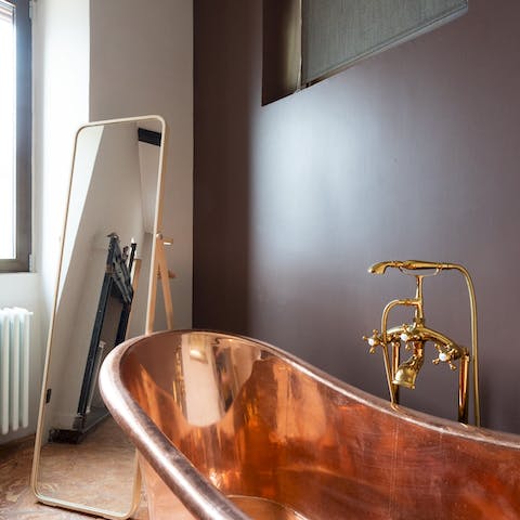 Fill up the copper bathtub in the bedroom and enjoy a restorative soak